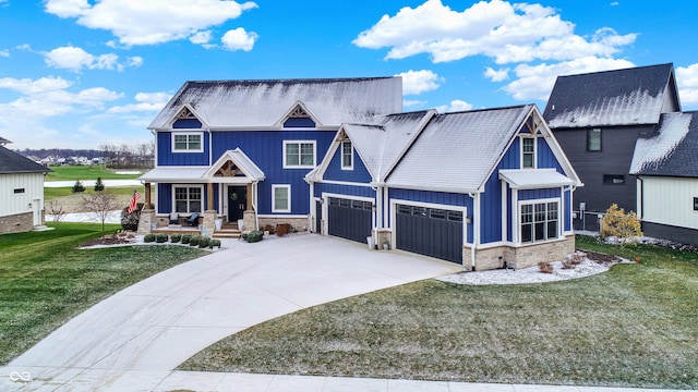 craftsman inspired home with a garage, a front lawn, and a porch