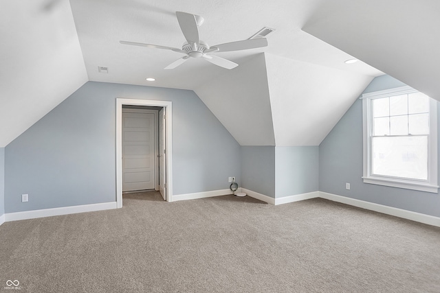 additional living space with ceiling fan, carpet floors, and lofted ceiling