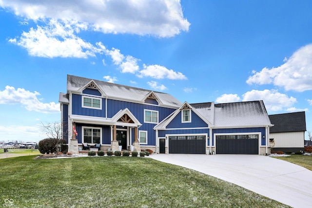 craftsman-style home with covered porch and a front lawn