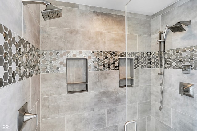 bathroom with tiled shower