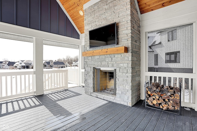 wooden deck featuring a fireplace