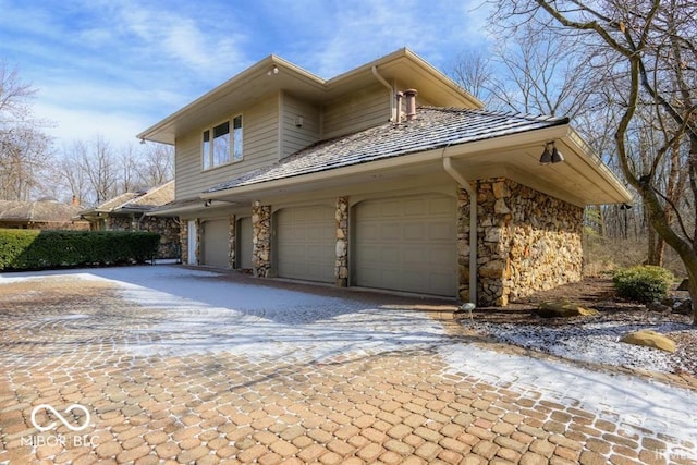 view of side of property featuring a garage