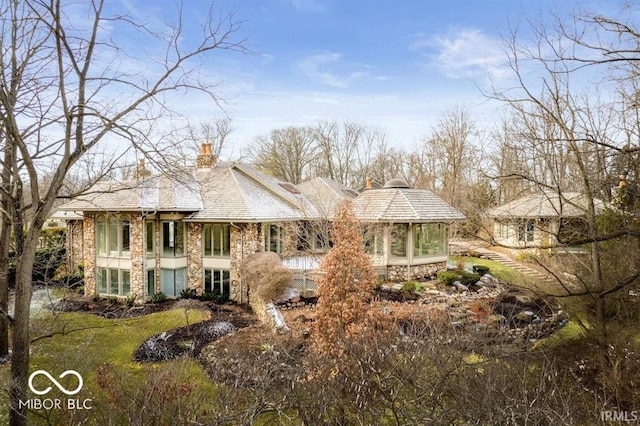 view of front facade featuring a sunroom