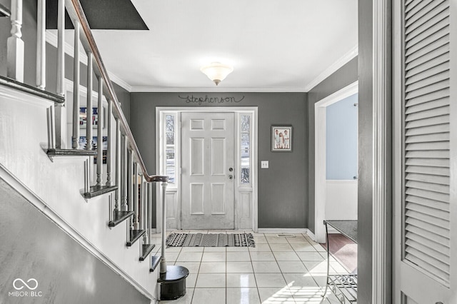 tiled foyer with ornamental molding