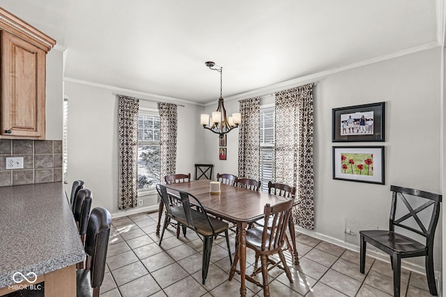 dining room featuring a notable chandelier, ornamental molding, and light tile patterned floors