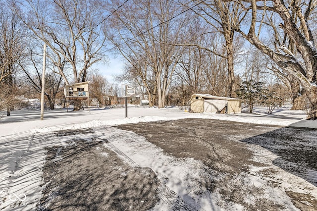 view of yard covered in snow