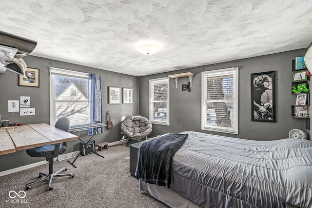 bedroom with carpet and a textured ceiling