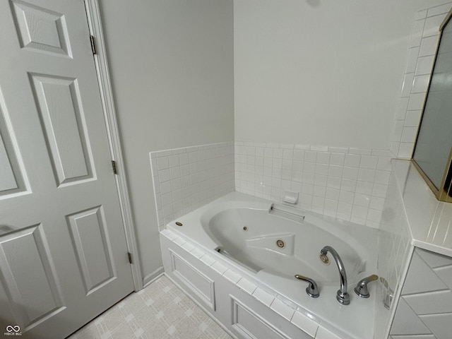 bathroom with tiled bath