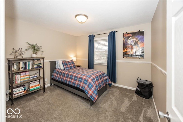 bedroom featuring carpet and baseboards