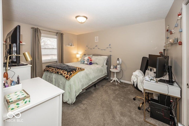 carpeted bedroom featuring baseboards