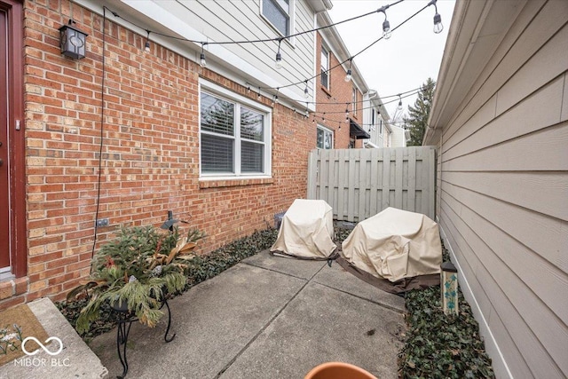 view of patio featuring fence