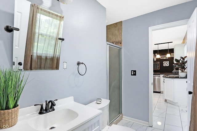 bathroom featuring an enclosed shower, vanity, and toilet