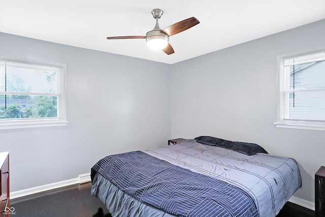 bedroom featuring baseboard heating and ceiling fan