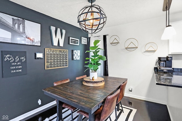 dining area featuring a textured ceiling