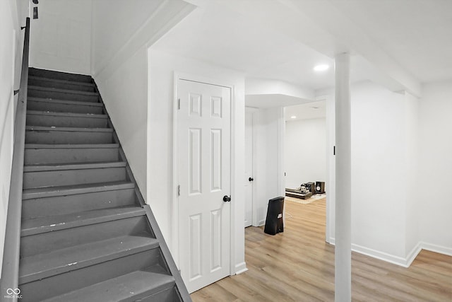 staircase featuring hardwood / wood-style flooring