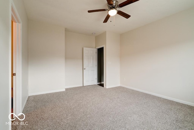 unfurnished bedroom with carpet flooring, a ceiling fan, and baseboards