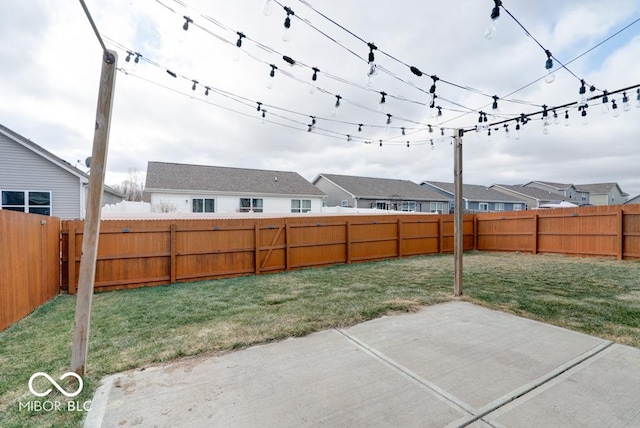 view of patio with a fenced backyard and a residential view