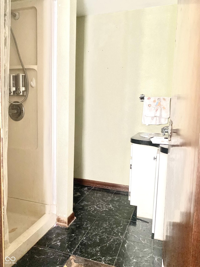 600 N Meridian St, Brazil, IN 47834 - bathroom featuring a shower stall, vanity, and baseboards