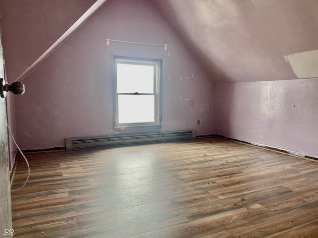 600 N Meridian St, Brazil, IN 47834 - bonus room with baseboard heating, wood finished floors, and vaulted ceiling