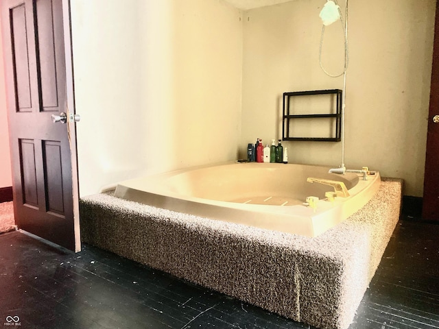 600 N Meridian St, Brazil, IN 47834 - bathroom featuring a garden tub and wood finished floors