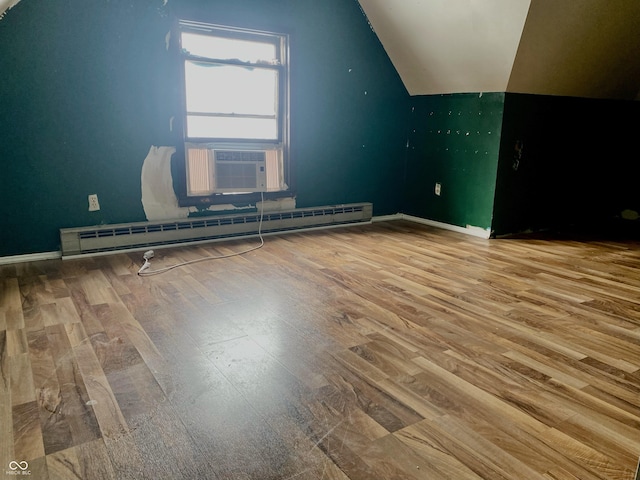 600 N Meridian St, Brazil, IN 47834 - additional living space featuring a baseboard heating unit, lofted ceiling, wood finished floors, and baseboards
