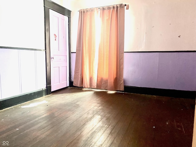 600 N Meridian St, Brazil, IN 47834 - unfurnished room featuring hardwood / wood-style floors and a decorative wall