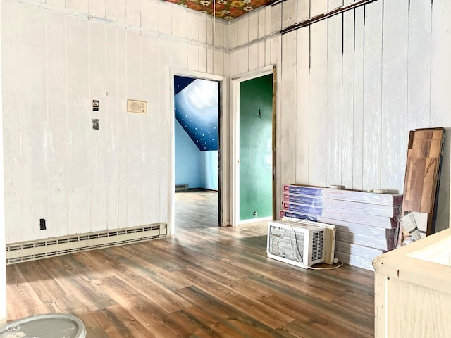 600 N Meridian St, Brazil, IN 47834 - empty room featuring a baseboard radiator, wood finished floors, and wooden walls