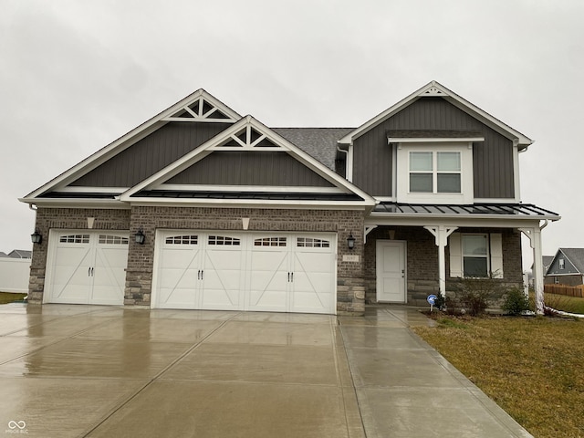 view of front of home featuring a garage and a front yard