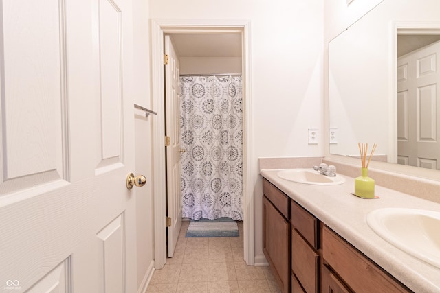 bathroom featuring a sink and double vanity