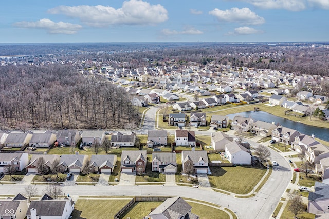 bird's eye view featuring a residential view and a water view