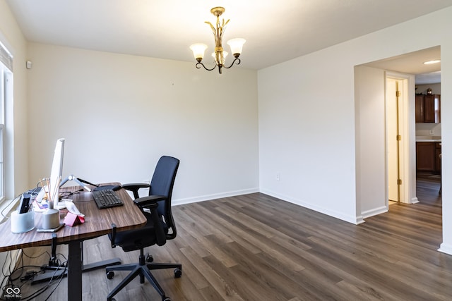 office with baseboards, dark wood-type flooring, and an inviting chandelier