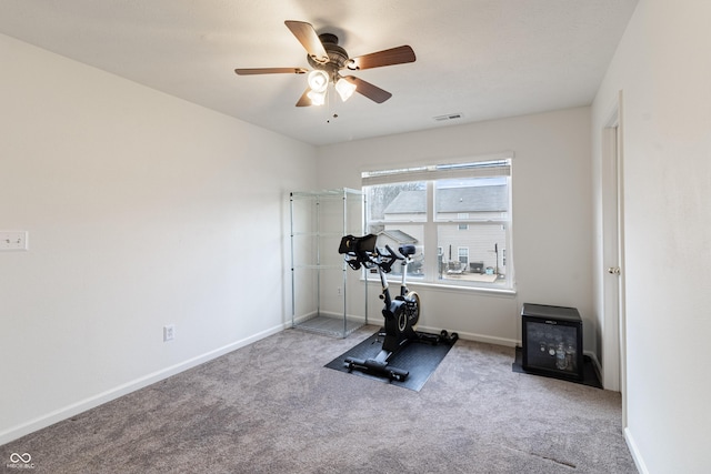 workout room featuring carpet flooring, baseboards, visible vents, and a ceiling fan