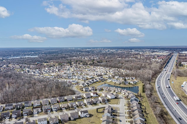 aerial view featuring a residential view and a water view