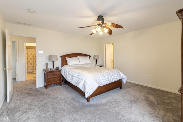 carpeted bedroom featuring visible vents, a ceiling fan, and baseboards