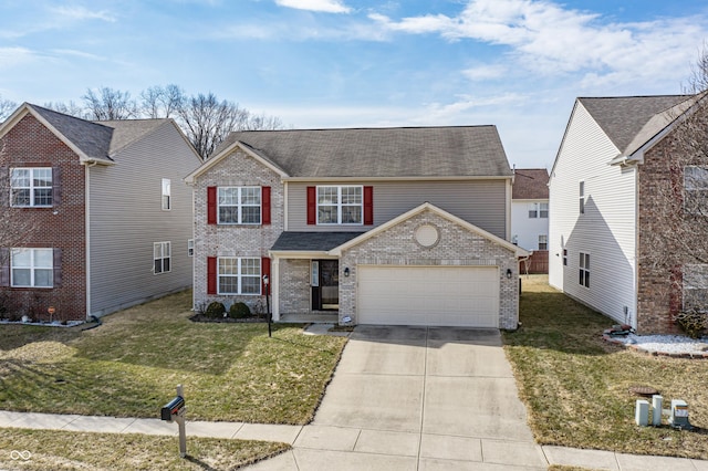 traditional-style house featuring brick siding, driveway, an attached garage, and a front yard