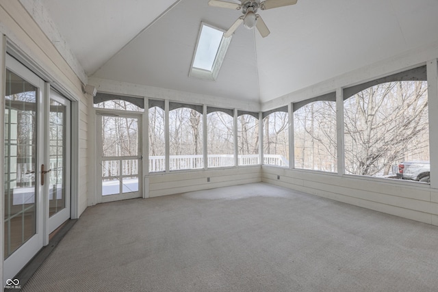 unfurnished sunroom with vaulted ceiling with skylight and ceiling fan