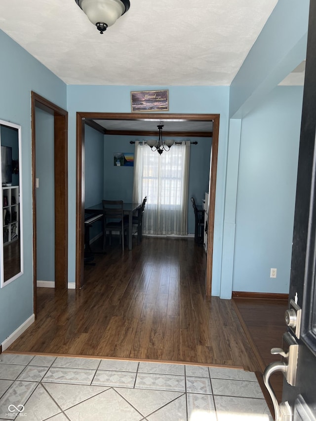 interior space featuring hardwood / wood-style floors and a chandelier