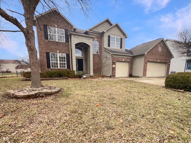 view of front of house featuring a front yard and a garage