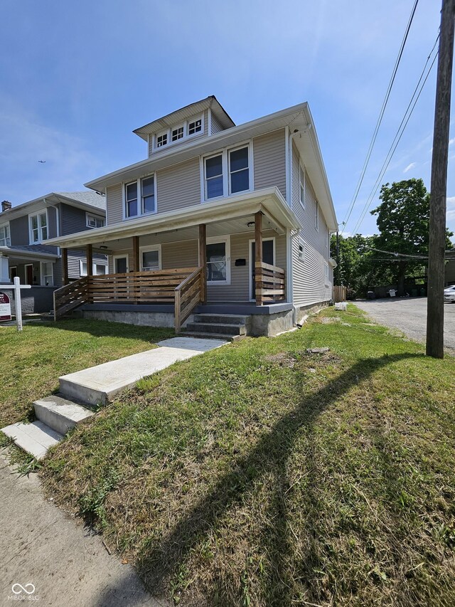 19 Parkview Ave, Indianapolis, IN 46201 - american foursquare style home featuring a porch and a front lawn