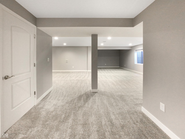 basement with light colored carpet