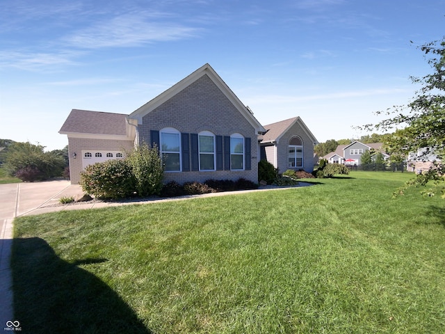 ranch-style house featuring a garage and a front yard