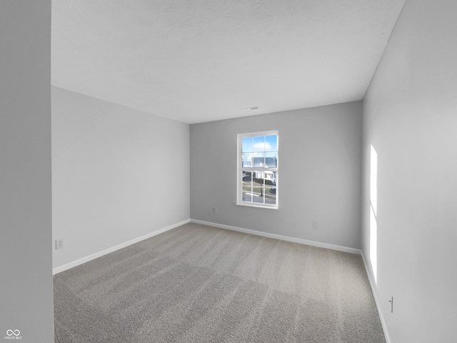 unfurnished room with carpet floors