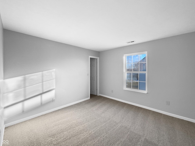 unfurnished room with carpet flooring