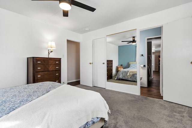 bedroom featuring ceiling fan and dark carpet