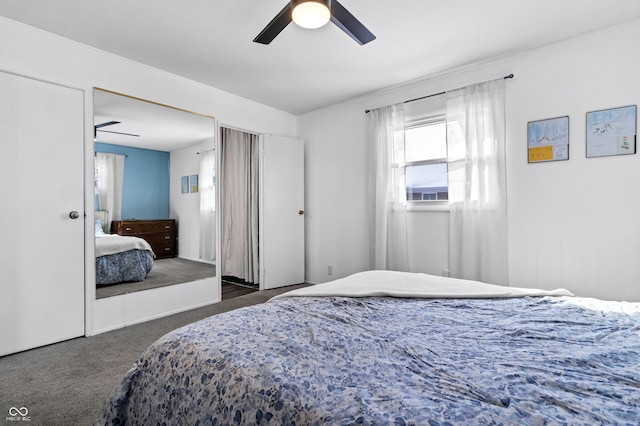 bedroom with dark colored carpet and a ceiling fan