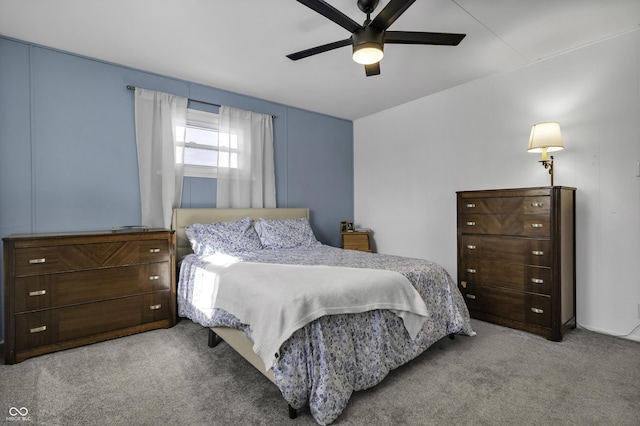 bedroom featuring light colored carpet and ceiling fan