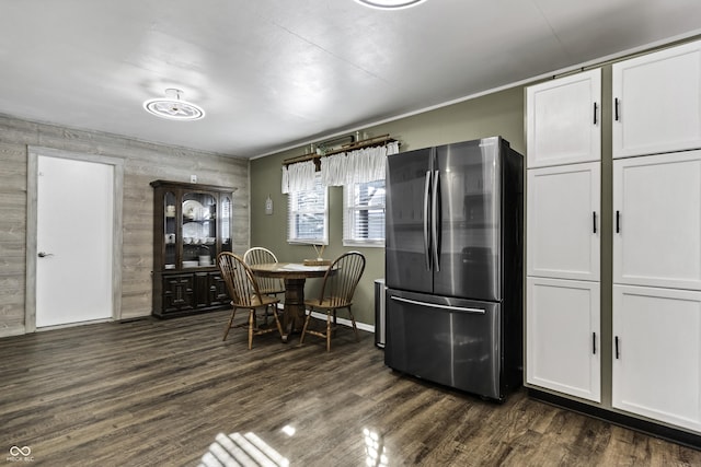 kitchen with white cabinetry, dark wood-type flooring, and freestanding refrigerator