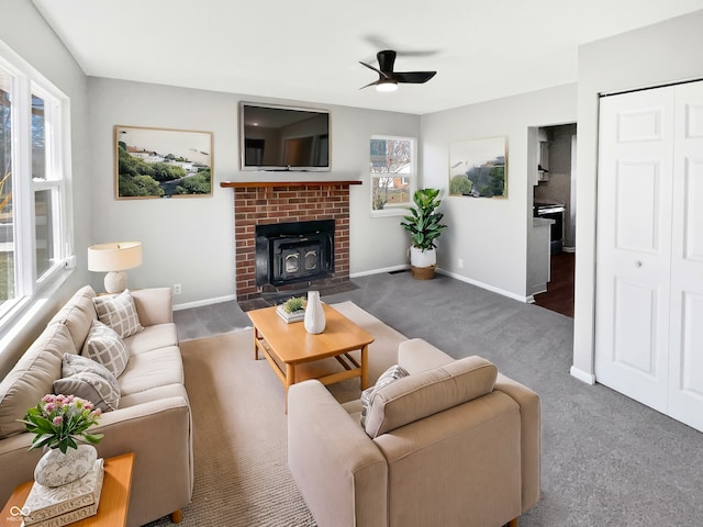 living room featuring dark colored carpet and ceiling fan