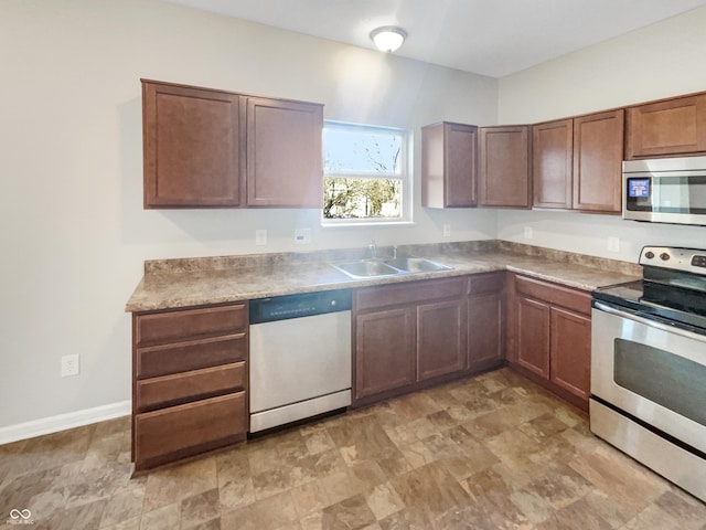 kitchen featuring appliances with stainless steel finishes and sink