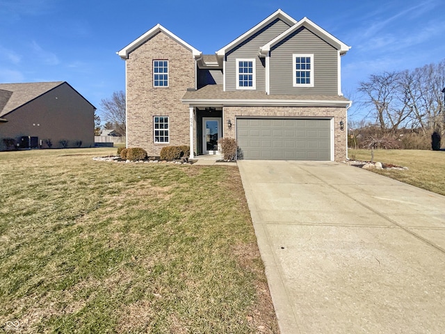 front of property featuring a front lawn and a garage